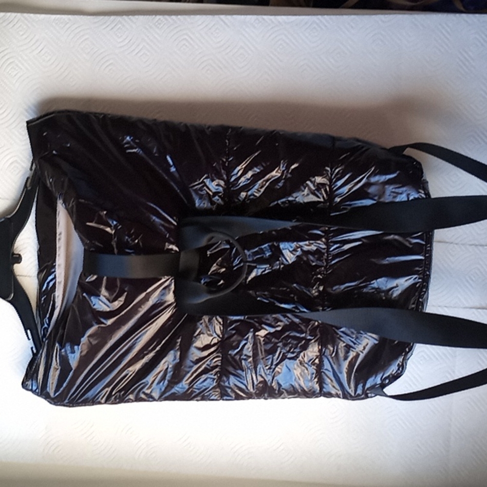 Back pack New Shiny black with lock clasp large. This is unisex.